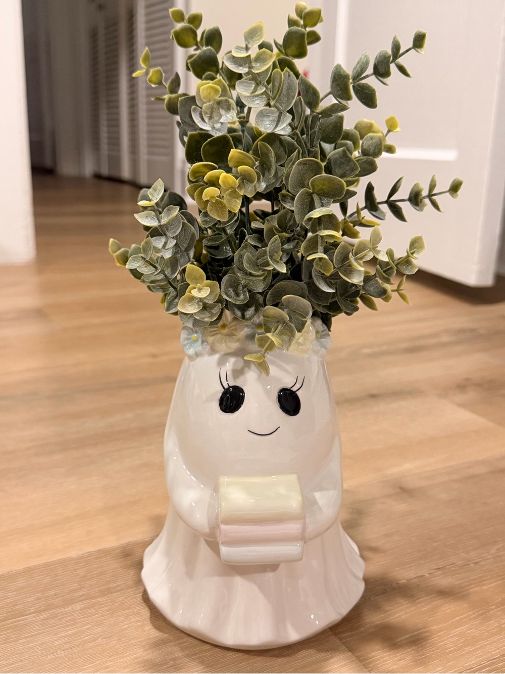 Ghost with floral crown holding books Planter with Greenery